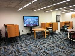 CAST study hall with monitor, desks and, chairs
